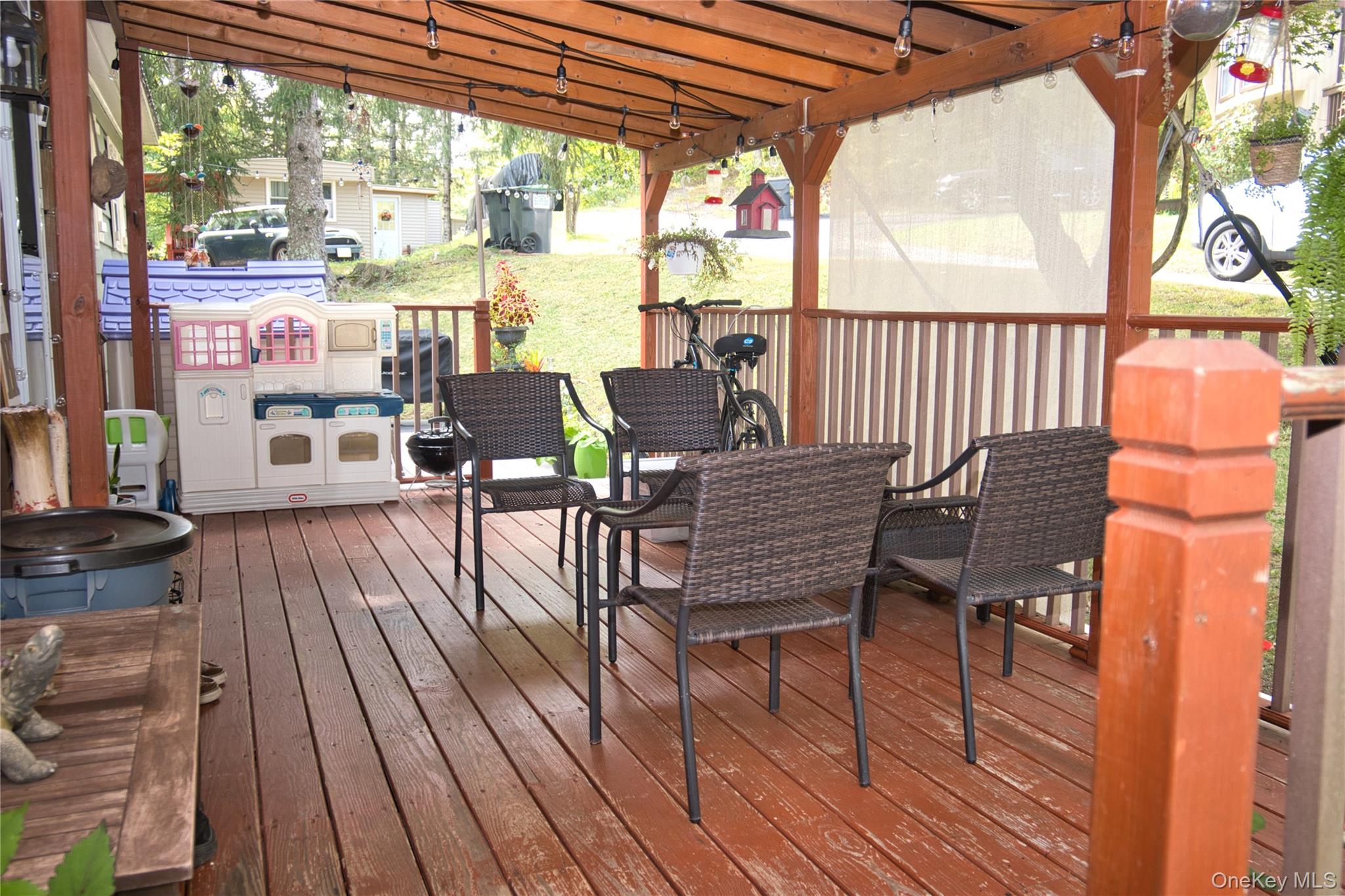 165 Lattintown Road, Unit 75 Newburgh, NY 12550 - Photo 21 of 24 Wooden Covered patio for entertaining and relaxing.