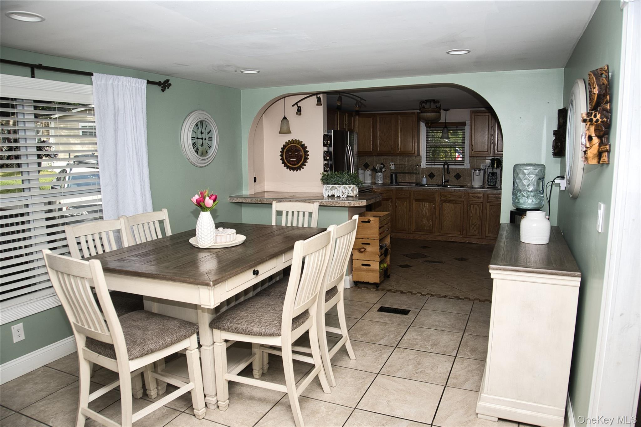 165 Lattintown Road, Unit 75 Newburgh, NY 12550 - Photo 5 of 24 Dining space with light tile patterned floors, arched walkways, and recessed lighting