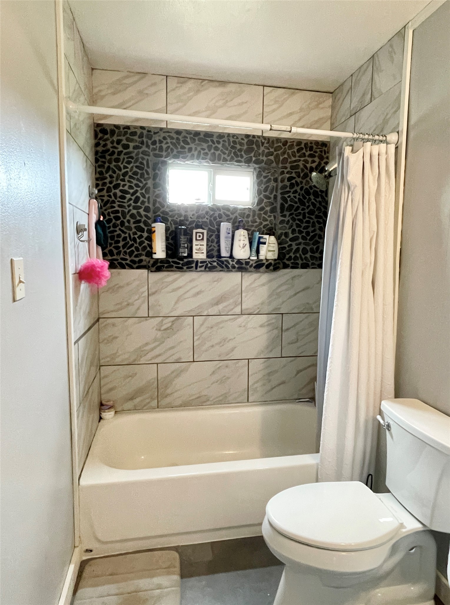 136 Fm 2239 Road Paige, TX 78659 - Photo 12 of 29 a bathroom with a toilet a sink and bathtub