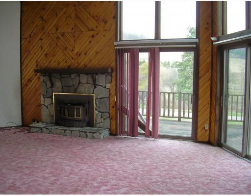 384 Lindsay Run Road Spring Church, PA 15686 - Photo 3 of 16 Den/Family/Great Room. The first floor Great Room has the stone fireplace and sliding doors to the front deck.