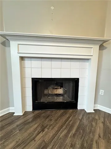 a bedroom with a fireplace and a fireplace