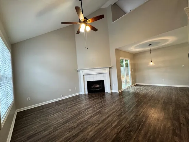 wooden floor fireplace and natural light in room