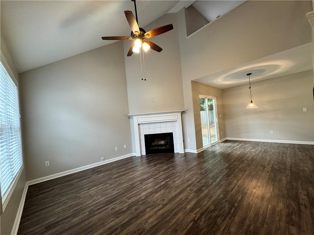 204 Park Place Woodstock, GA 30189 - Photo 2 of 22 wooden floor fireplace and natural light in room