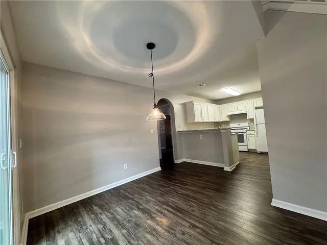 a view of a kitchen with wooden floor