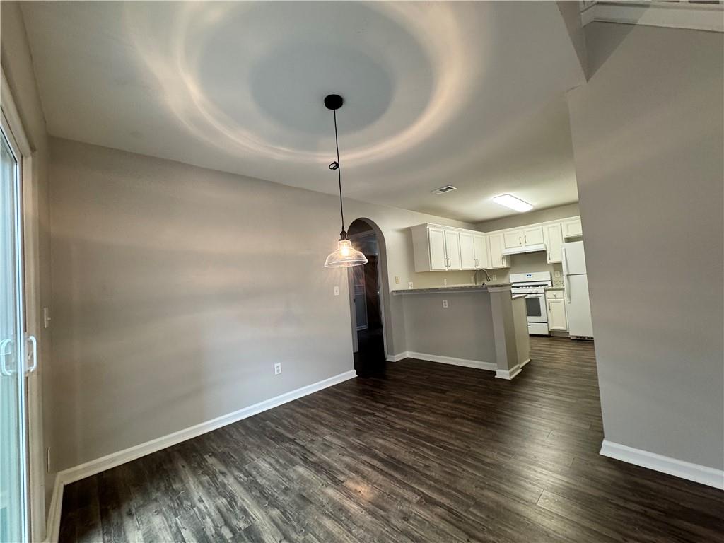 204 Park Place Woodstock, GA 30189 - Photo 4 of 22 a view of a kitchen with wooden floor