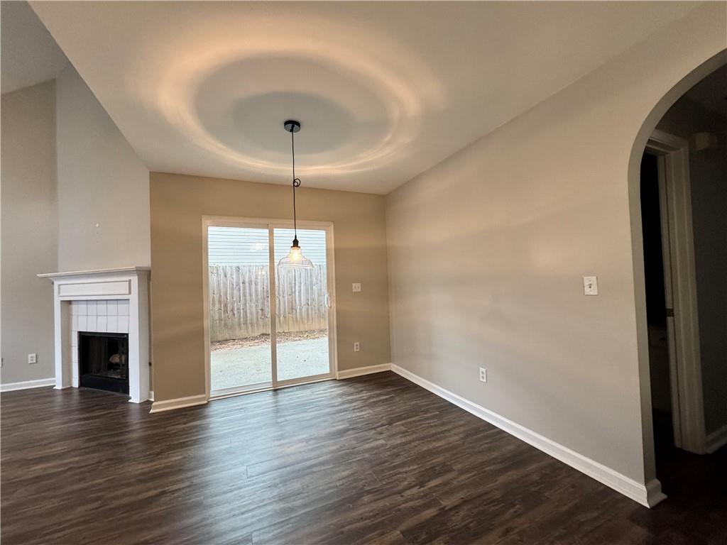 204 Park Place Woodstock, GA 30189 - Photo 5 of 22 wooden floor in an empty room with a window