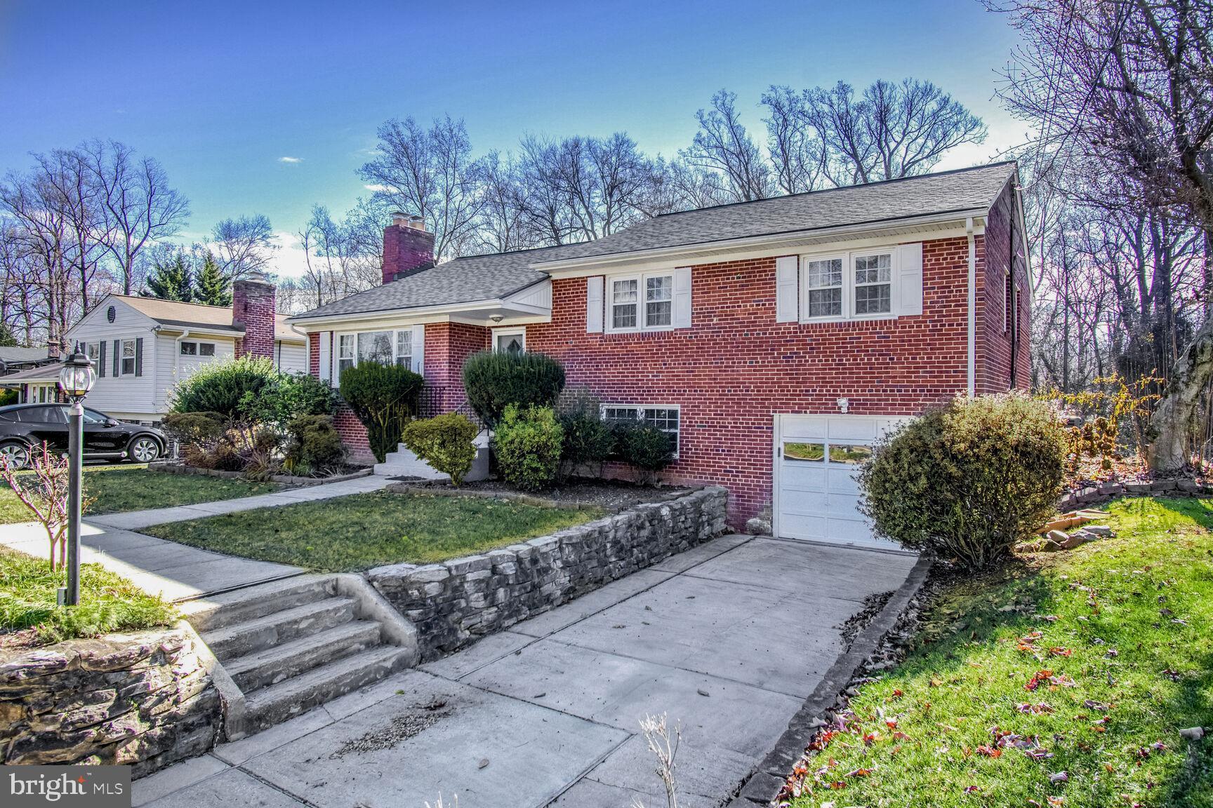 1113 Brantford Avenue Silver Spring, MD 20904 - Photo 1 of 35 a front view of a house with a yard and outdoor seating