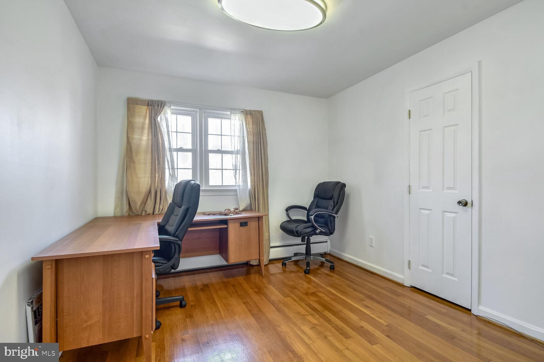 1113 Brantford Avenue Silver Spring, MD 20904 - Photo 19 of 35 a view of a workspace with furniture and a window
