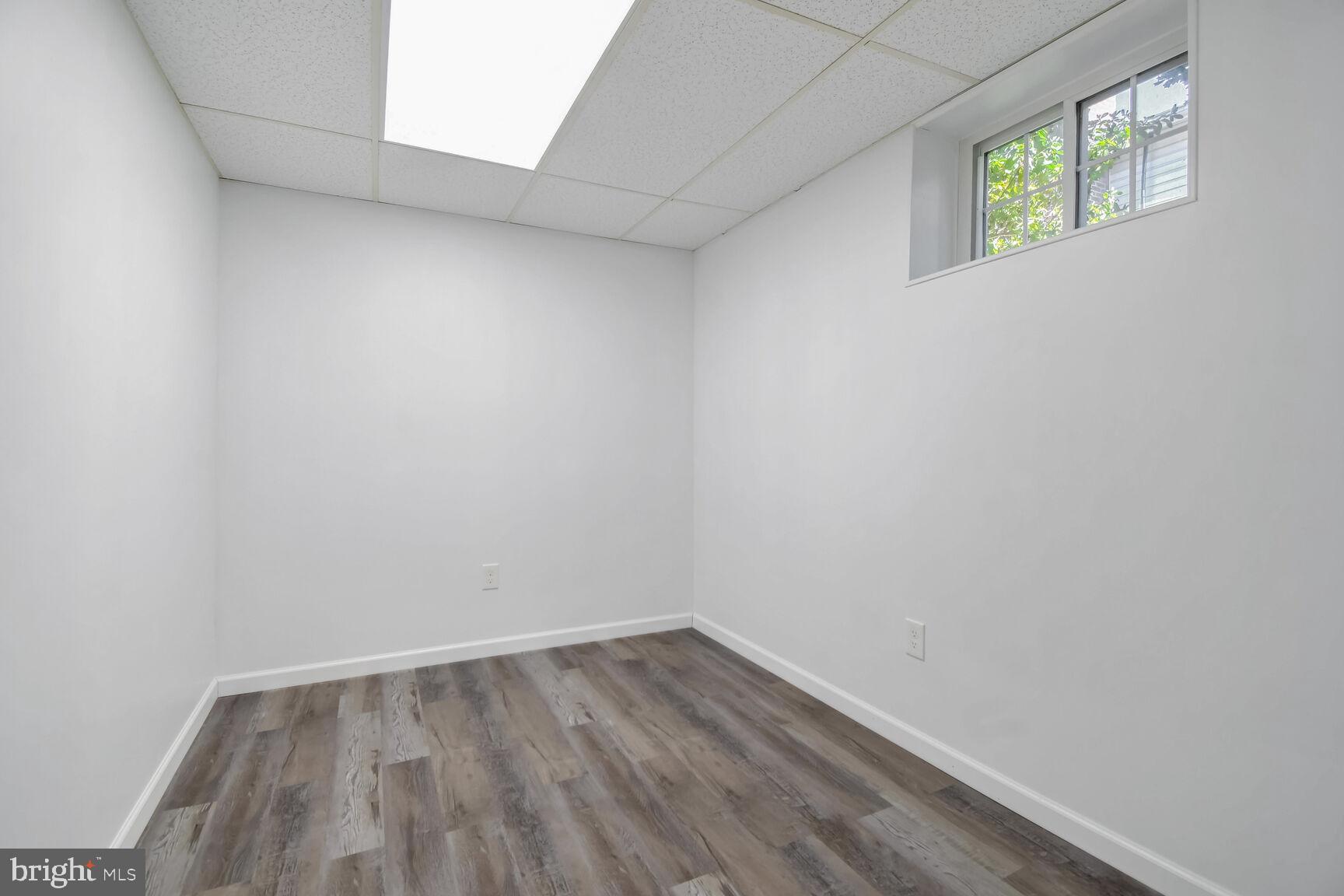 1113 Brantford Avenue Silver Spring, MD 20904 - Photo 21 of 35 a view of an empty room and wooden floor