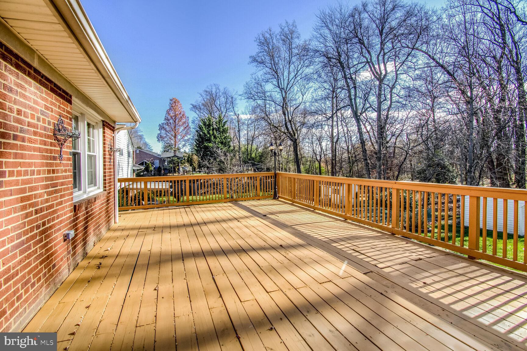 1113 Brantford Avenue Silver Spring, MD 20904 - Photo 29 of 35 a view of outdoor space with wooden floor and trees