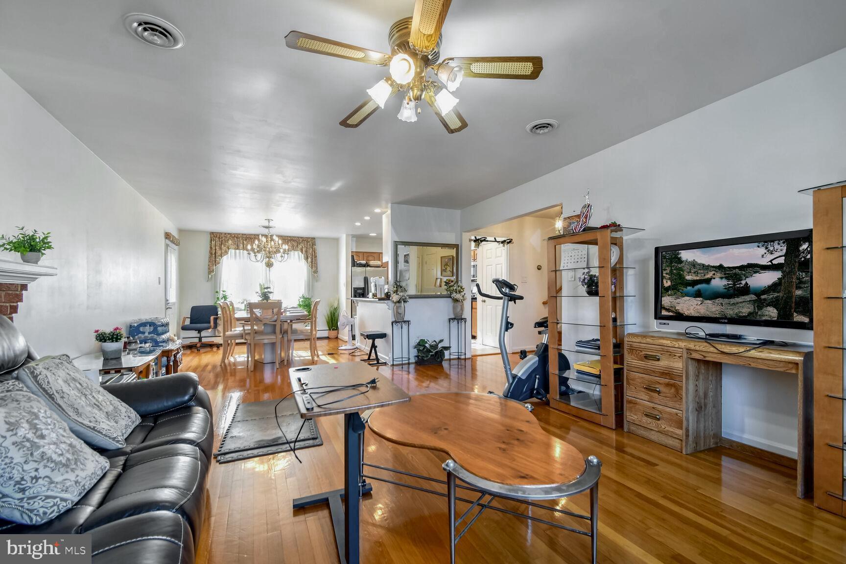 1113 Brantford Avenue Silver Spring, MD 20904 - Photo 7 of 35 a living room with furniture kitchen view and a flat screen tv