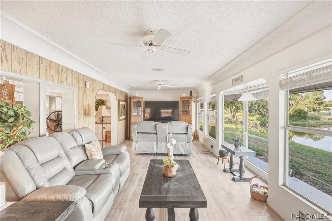 928 South Shad Terrace Inverness, FL 34450 - Photo 8 of 48 a living room with furniture large window and wooden floor