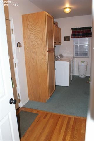 1055 Bowstring Road Monument, CO 80132 - Photo 17 of 22 Large Mud Room/Laundry Room. Built in Cabinetry.