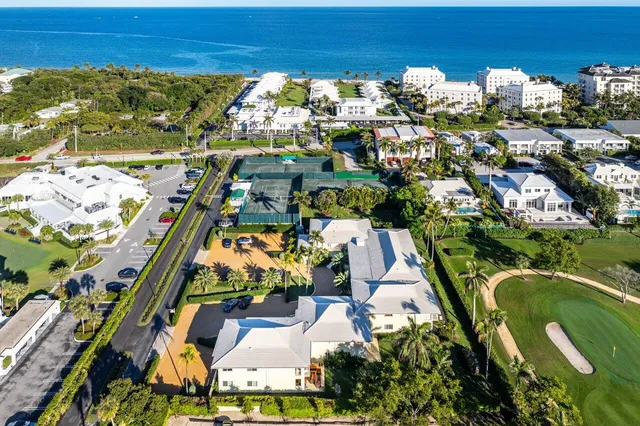 an aerial view of residential houses with outdoor space