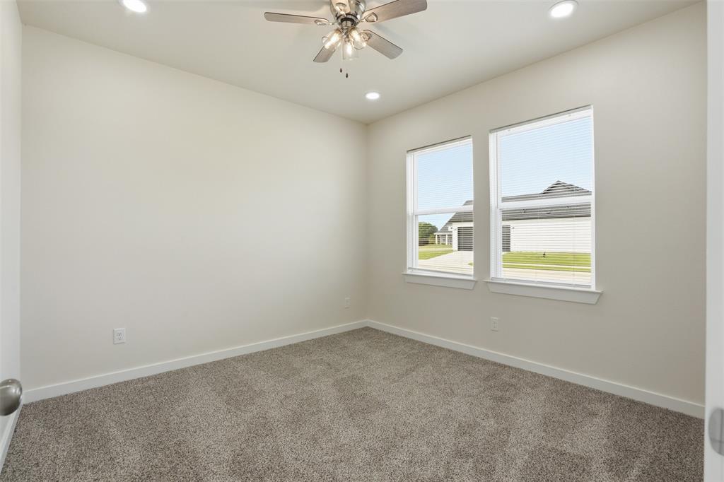 532 Highview Court Godley, TX 76044 - Photo 7 of 39 Carpeted room featuring dual windows, recessed lighting, a ceiling fan, and white baseboards