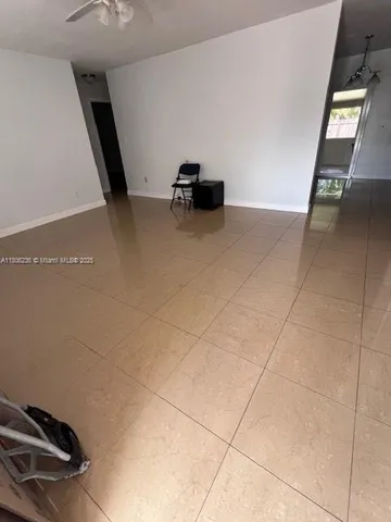 a view of an empty room and window