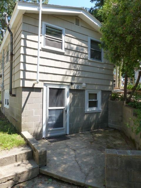 5 Hideaway Road, Unit 5G Buzzards Bay, MA 02532 - Photo 3 of 13 a front view of a house with a garage