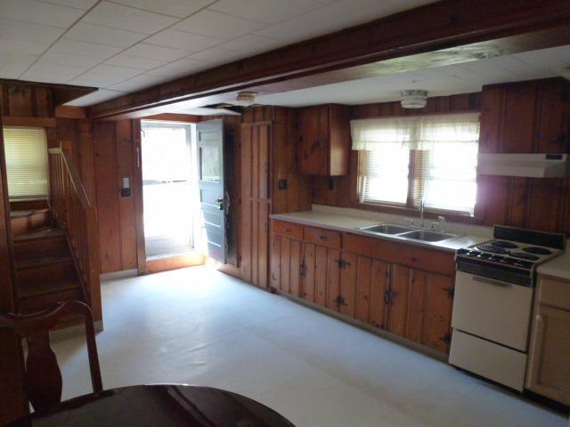 5 Hideaway Road, Unit 5G Buzzards Bay, MA 02532 - Photo 5 of 13 a kitchen with stainless steel appliances granite countertop a stove a sink and a refrigerator