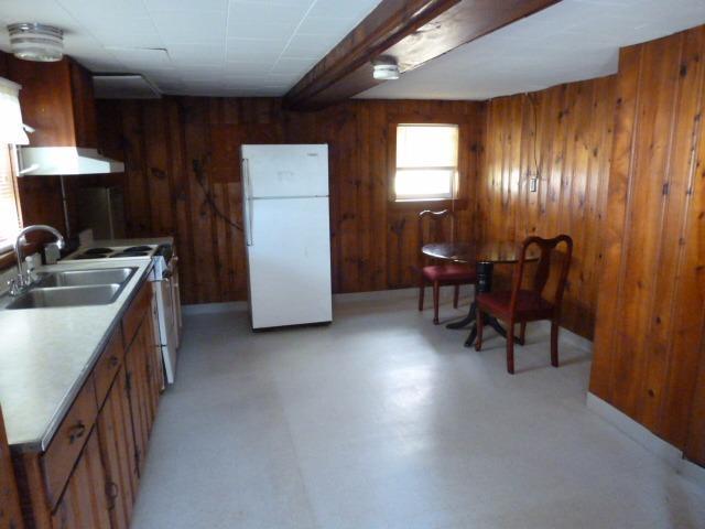 5 Hideaway Road, Unit 5G Buzzards Bay, MA 02532 - Photo 6 of 13 a kitchen with refrigerator and chairs