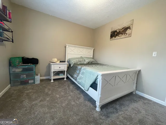 a room with a bed and a chair