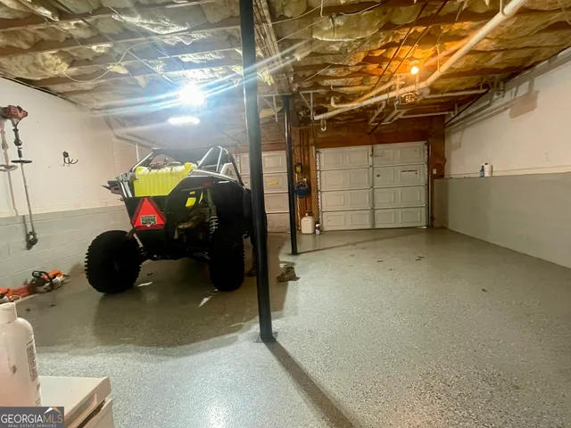 a view of a garage with wooden floor