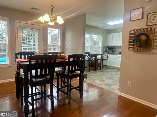 a view of a dining room with furniture window and outside view
