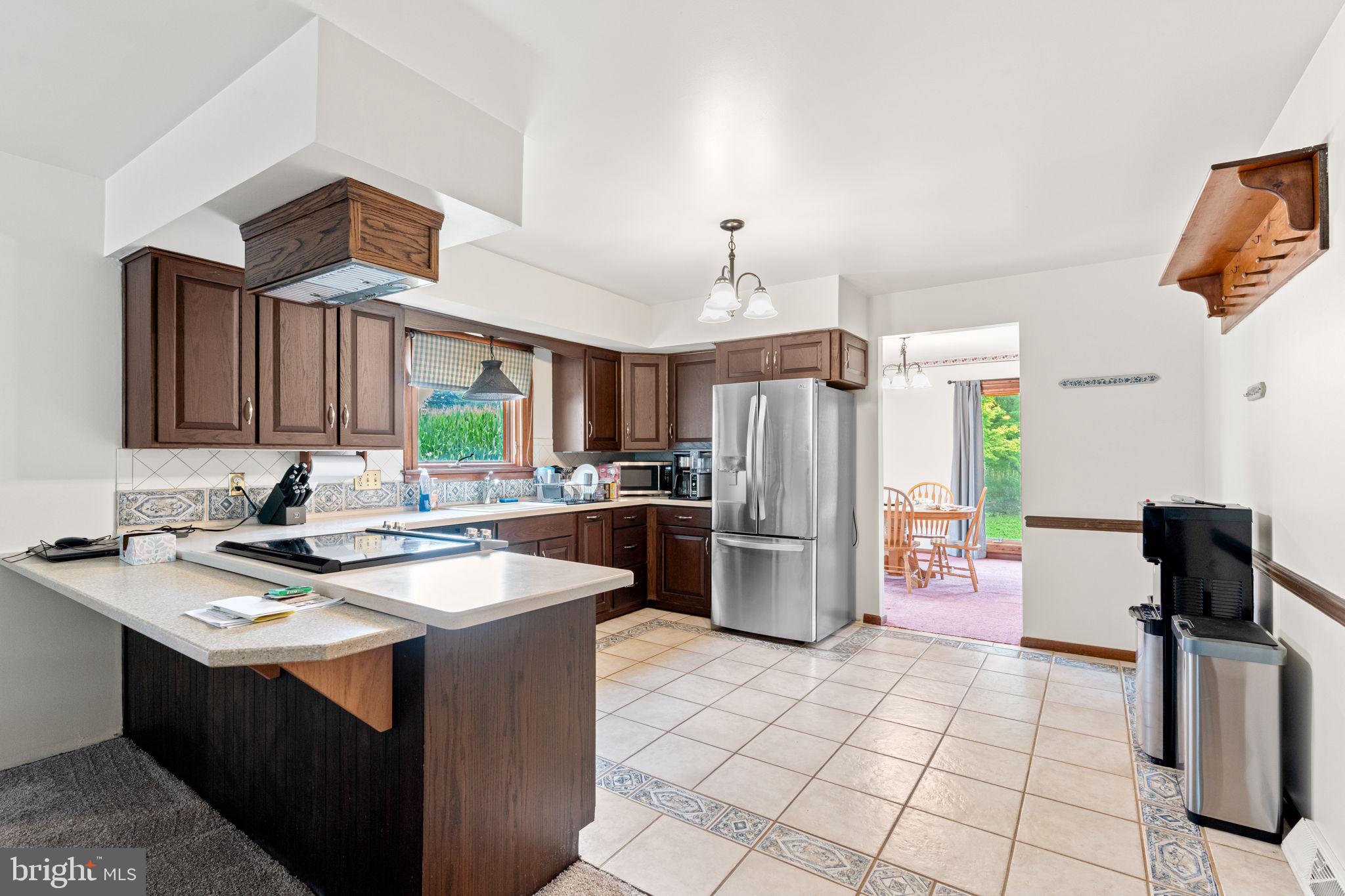 170 Sunset Road Oxford, PA 19363 - Photo 12 of 70 a kitchen with a sink a refrigerator and microwave