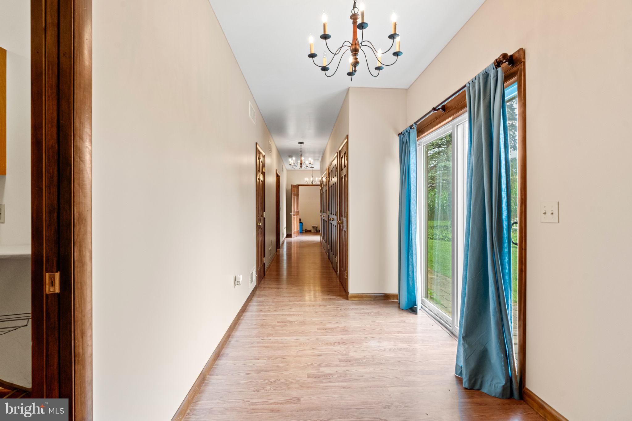 170 Sunset Road Oxford, PA 19363 - Photo 15 of 70 a view of a hallway with a chandelier