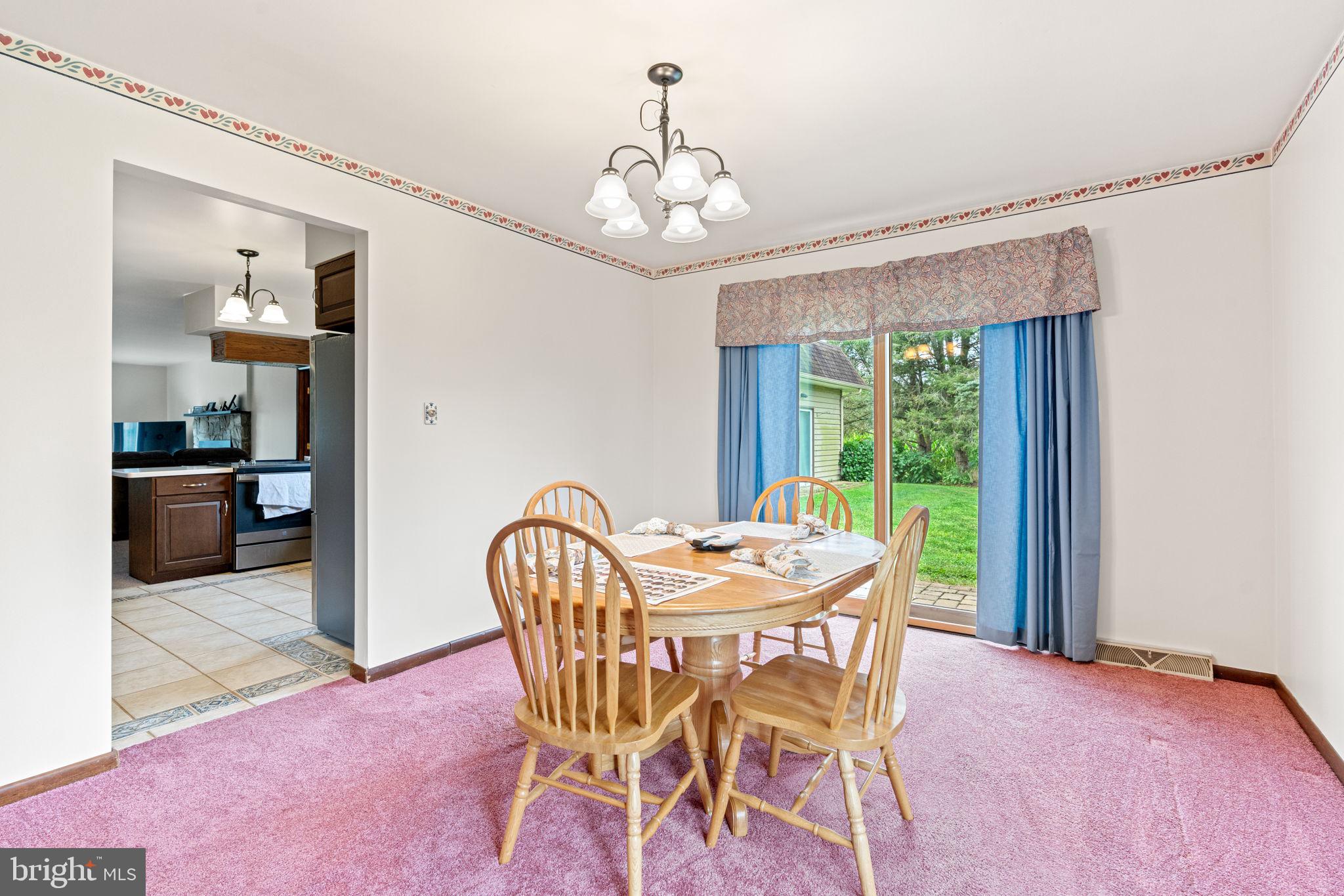 170 Sunset Road Oxford, PA 19363 - Photo 18 of 70 a dining room with furniture a chandelier and window