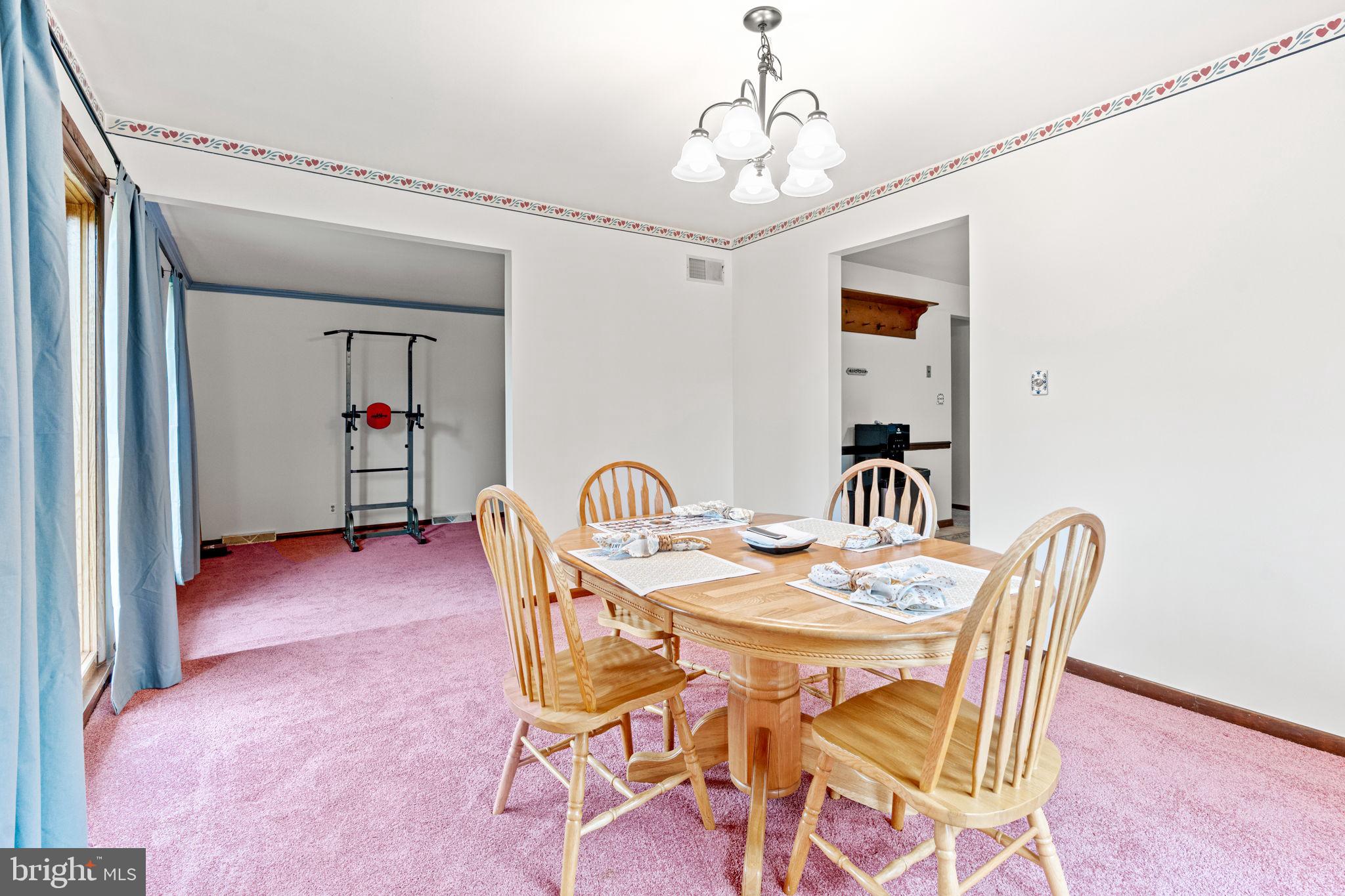 170 Sunset Road Oxford, PA 19363 - Photo 19 of 70 a view of a dining room with furniture and chandelier