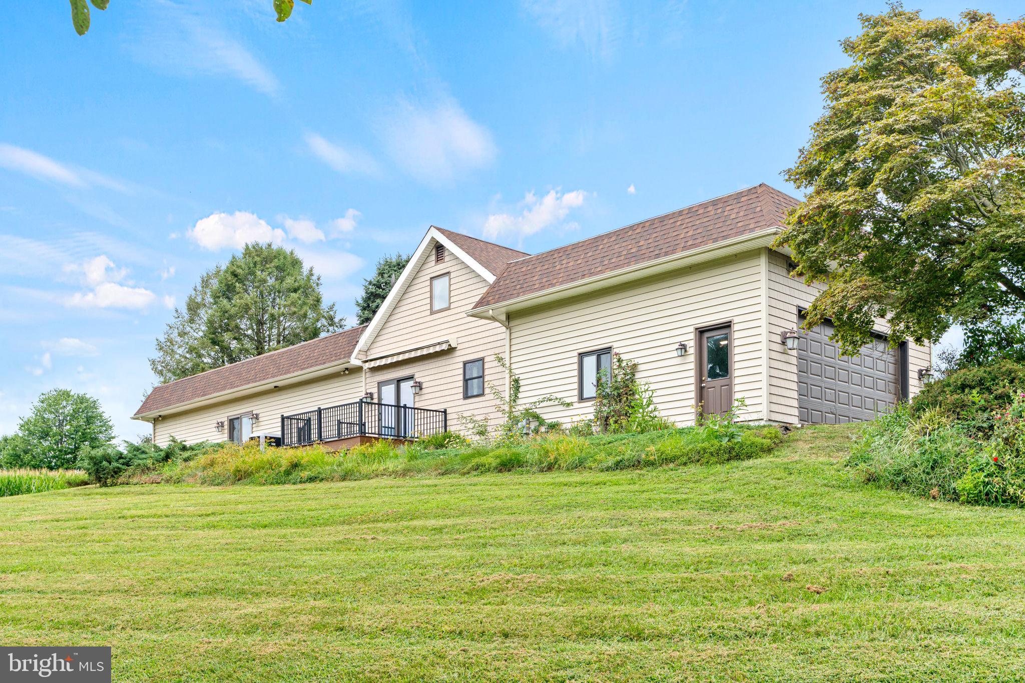 170 Sunset Road Oxford, PA 19363 - Photo 2 of 70 a house view with a garden space