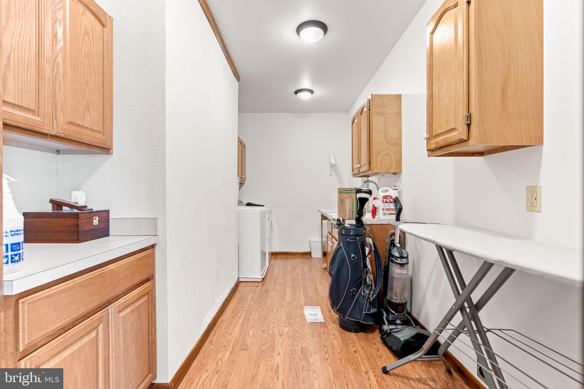 170 Sunset Road Oxford, PA 19363 - Photo 23 of 70 a view of a kitchen with fridge and wooden floor