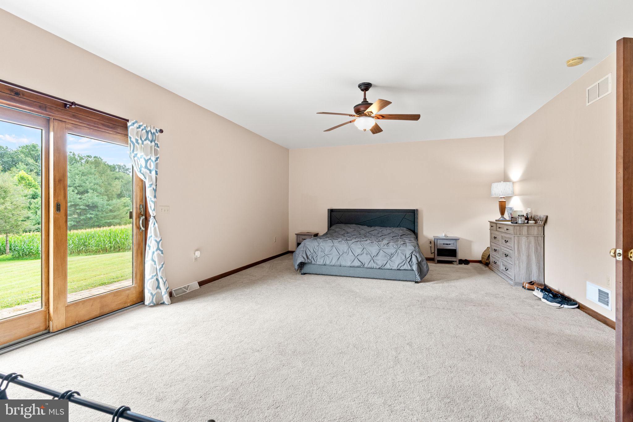 170 Sunset Road Oxford, PA 19363 - Photo 24 of 70 a big room with closet and a chandelier fan