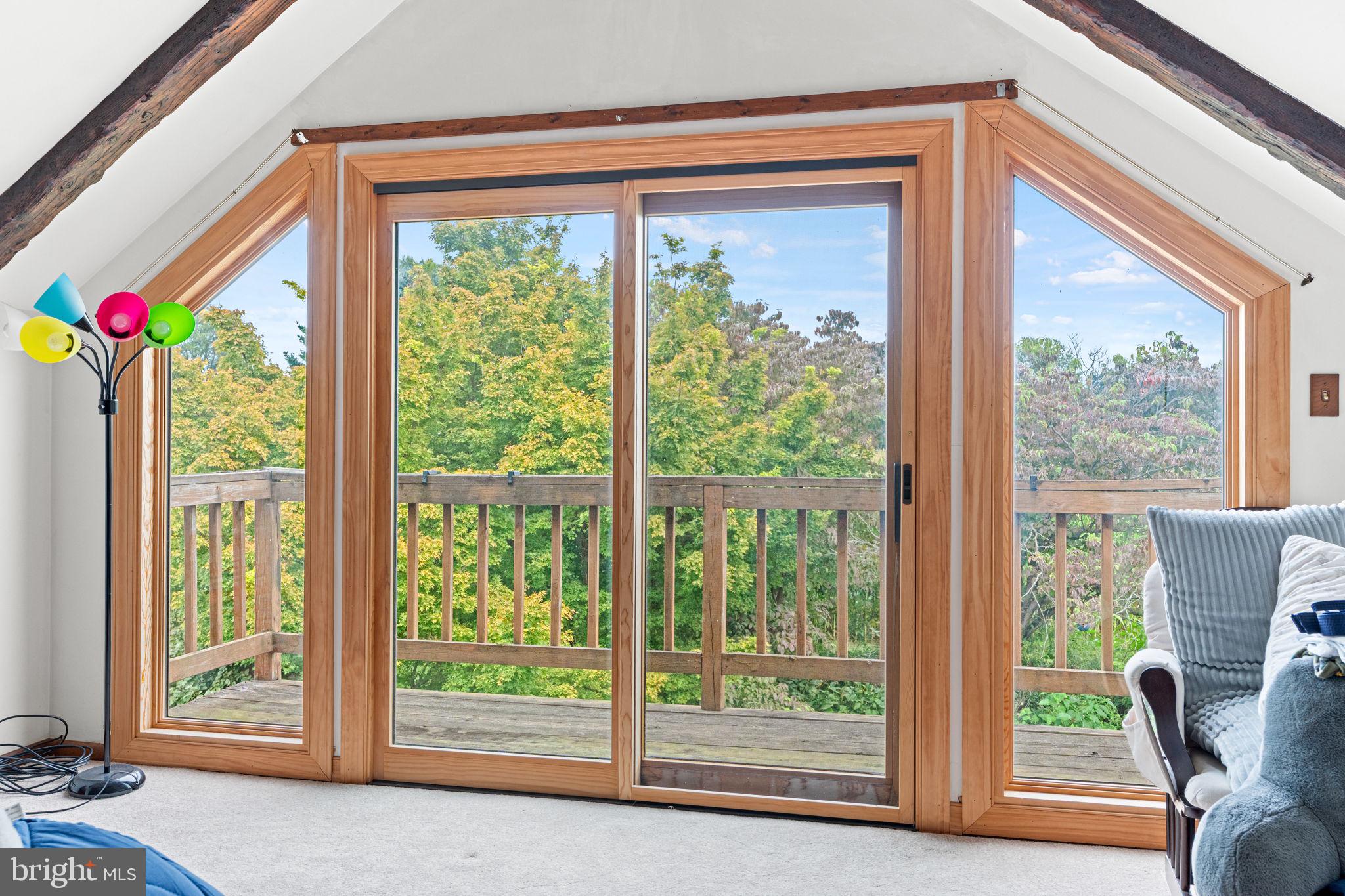 170 Sunset Road Oxford, PA 19363 - Photo 32 of 70 a view of a room that has a bed and glass door