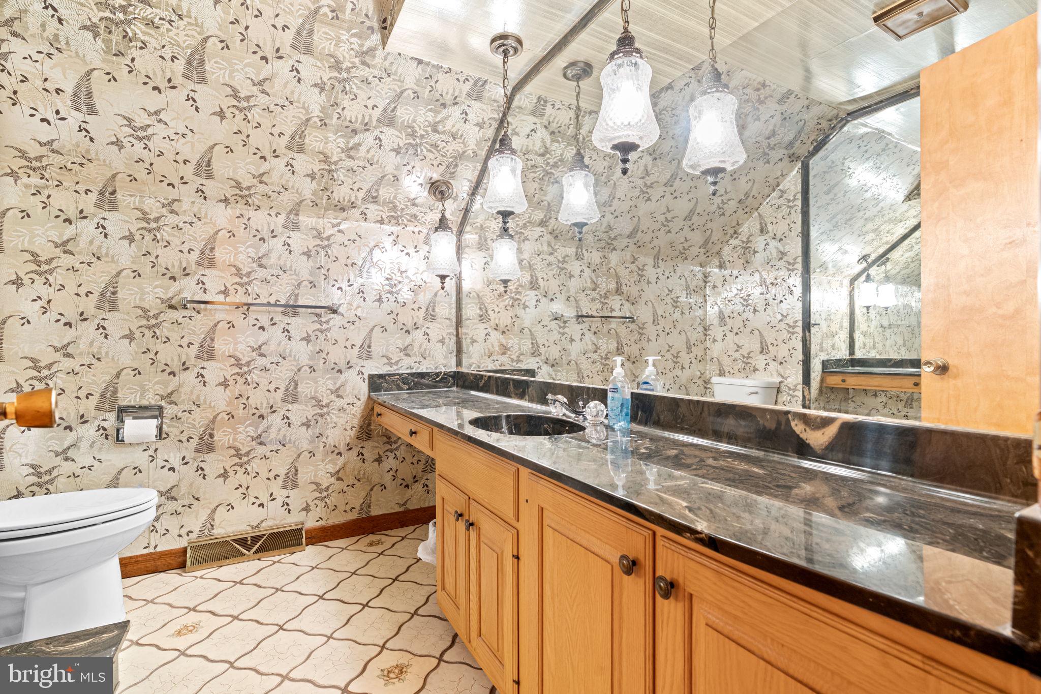 170 Sunset Road Oxford, PA 19363 - Photo 34 of 70 a bathroom with a granite countertop sink and a mirror