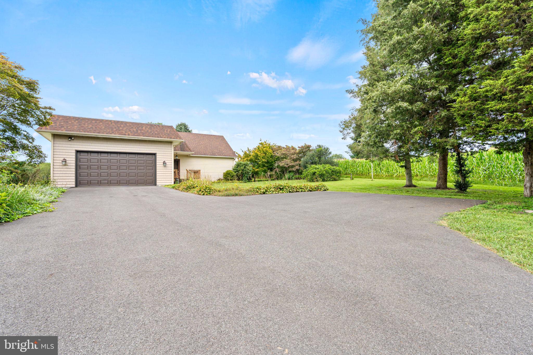 170 Sunset Road Oxford, PA 19363 - Photo 5 of 70 a view of a house with a big yard and large tree