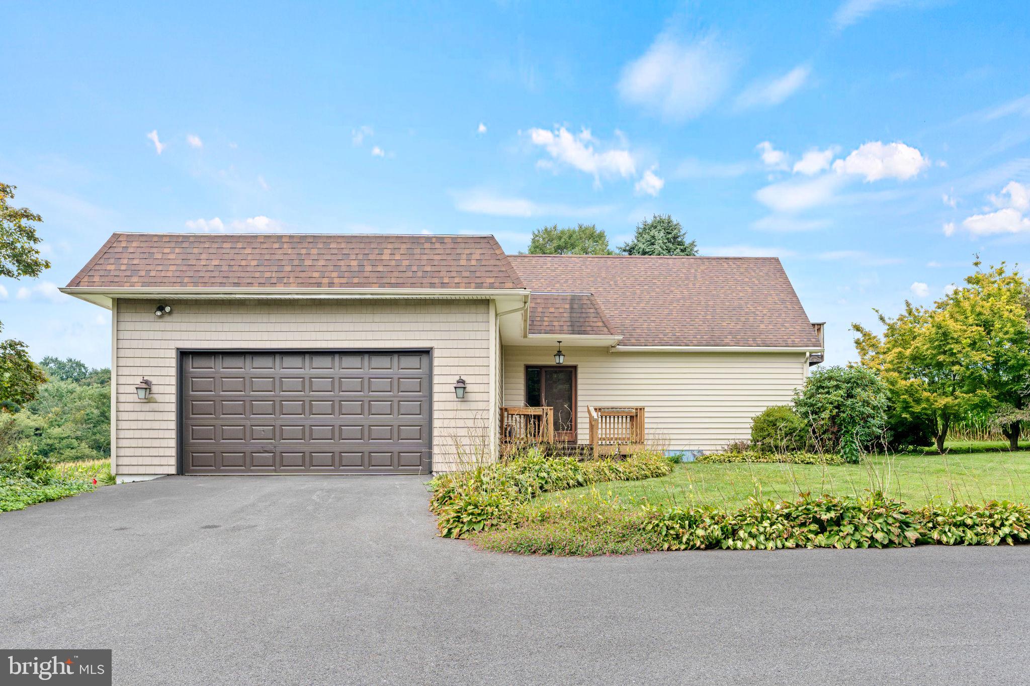 170 Sunset Road Oxford, PA 19363 - Photo 6 of 70 a front view of a house with a garden