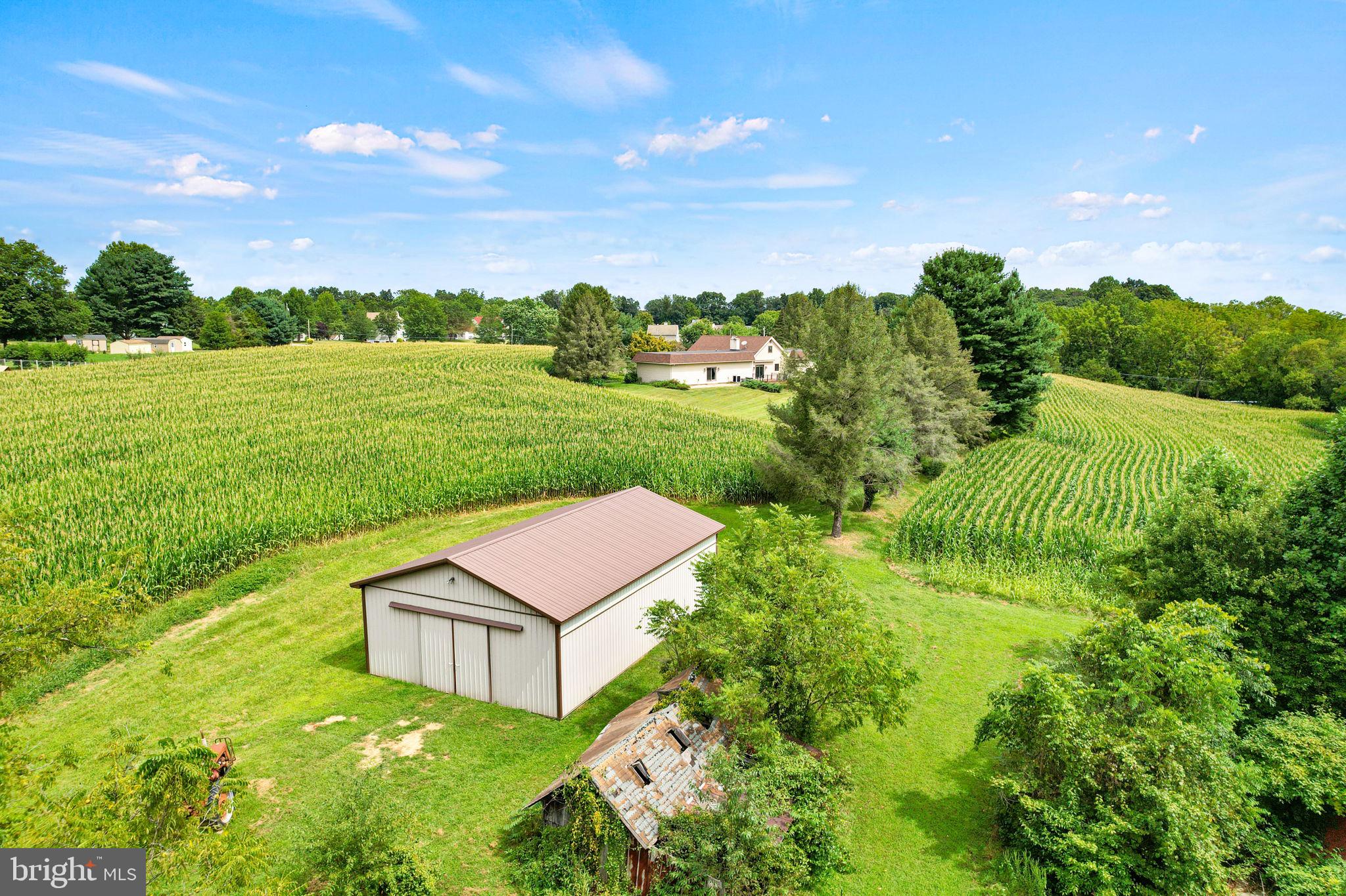 170 Sunset Road Oxford, PA 19363 - Photo 62 of 70 a view of a garden with an buildings and a big yard
