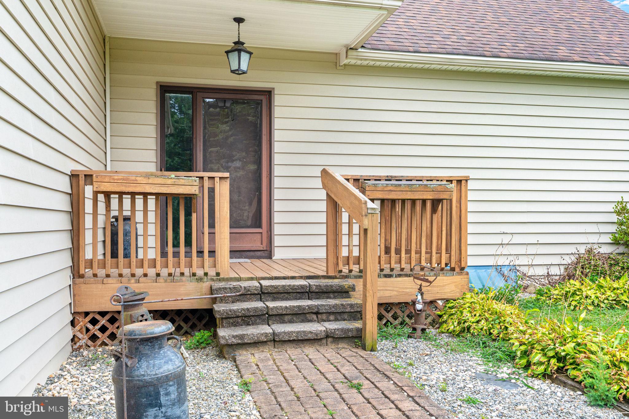 170 Sunset Road Oxford, PA 19363 - Photo 7 of 70 a front view of a house with a chairs