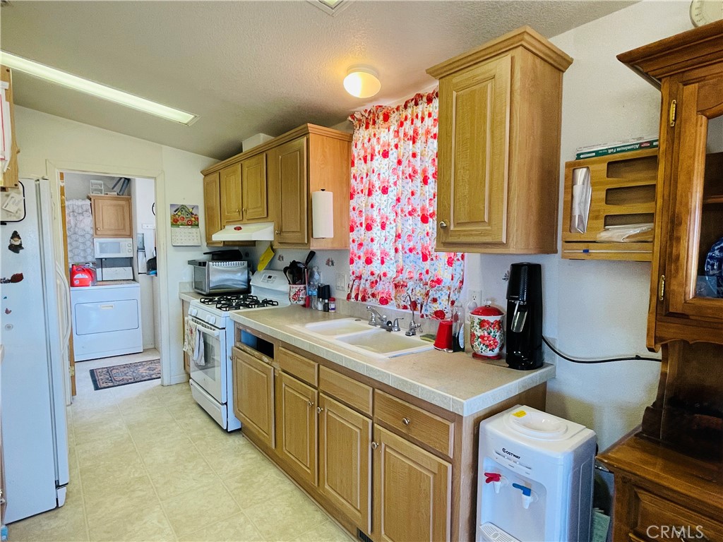 12955 Boy Scout Camp Road Frazier Park, CA 93225 - Photo 4 of 14 a kitchen with a sink stove and refrigerator
