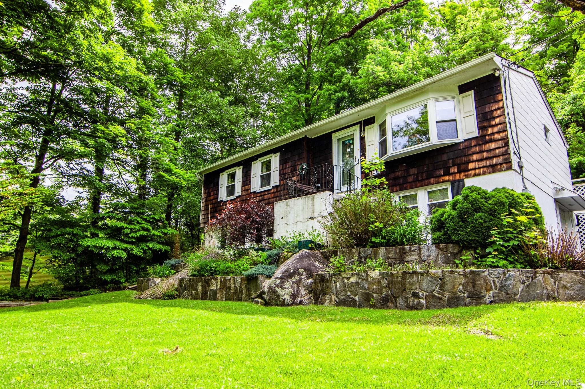 36 Rochambeau Road Garrison, NY 10524 - Photo 2 of 39 Beautiful flat front yard with stone retaining walls
