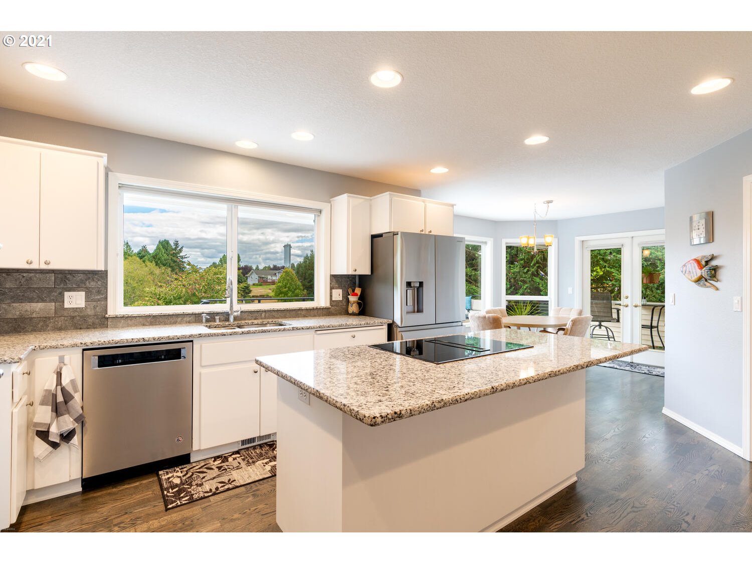 2170 South 26th Avenue Ridgefield, WA 98642 - Photo 11 of 32 a kitchen with counter top space appliances and a large window