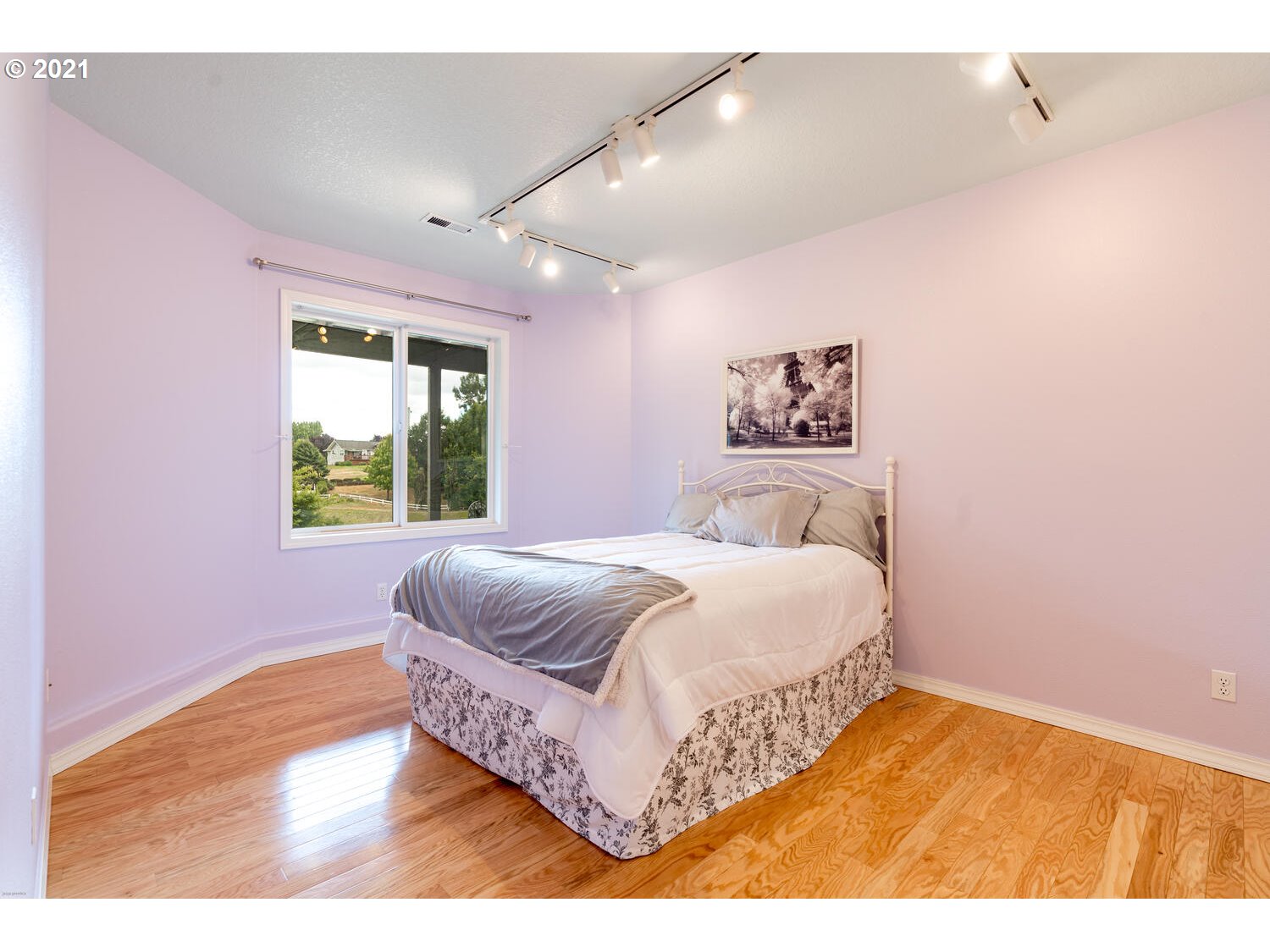 2170 South 26th Avenue Ridgefield, WA 98642 - Photo 23 of 32 a bedroom with a bed and a painting on the wall