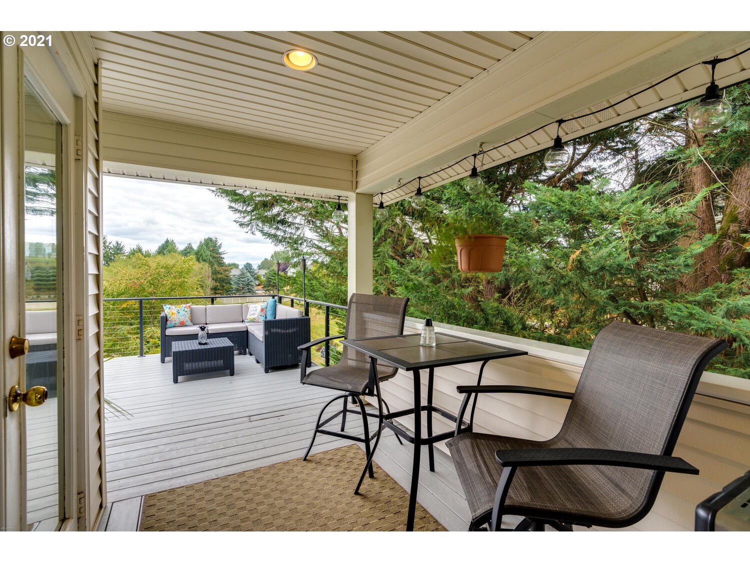 2170 South 26th Avenue Ridgefield, WA 98642 - Photo 26 of 32 a view of a patio with table and chairs and potted plants