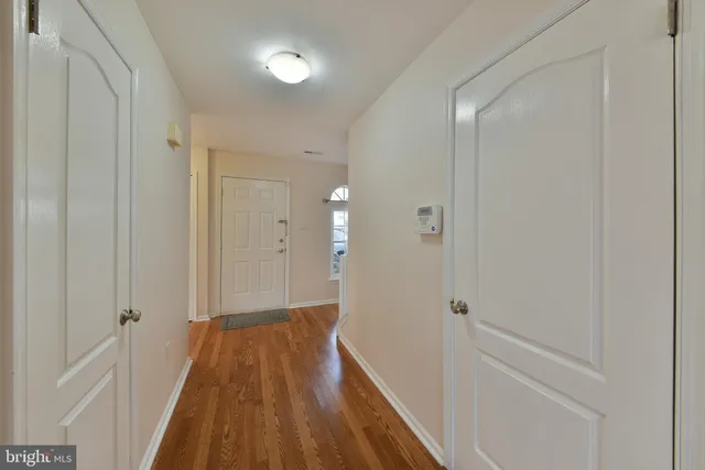a bathroom with a sink and a glass door shower