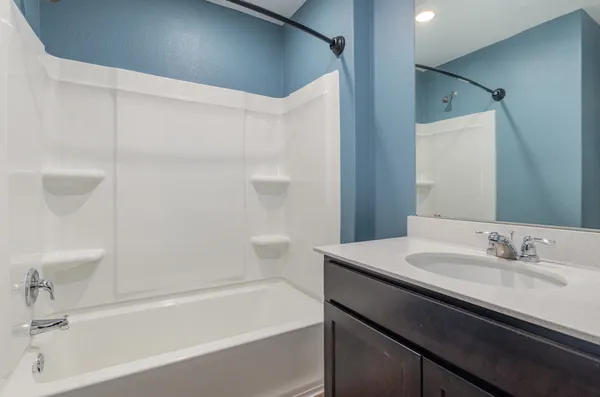 a bathroom with a sink a toilet and a bathtub