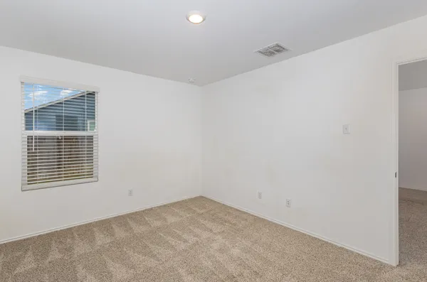 a view of a room that has a window in it