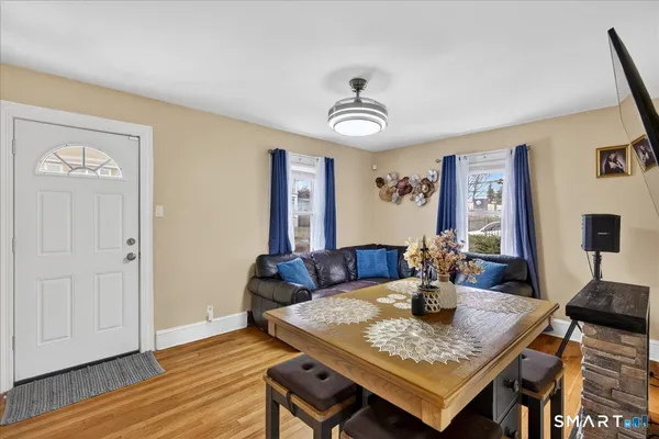 a view of a dining room with furniture and wooden floor