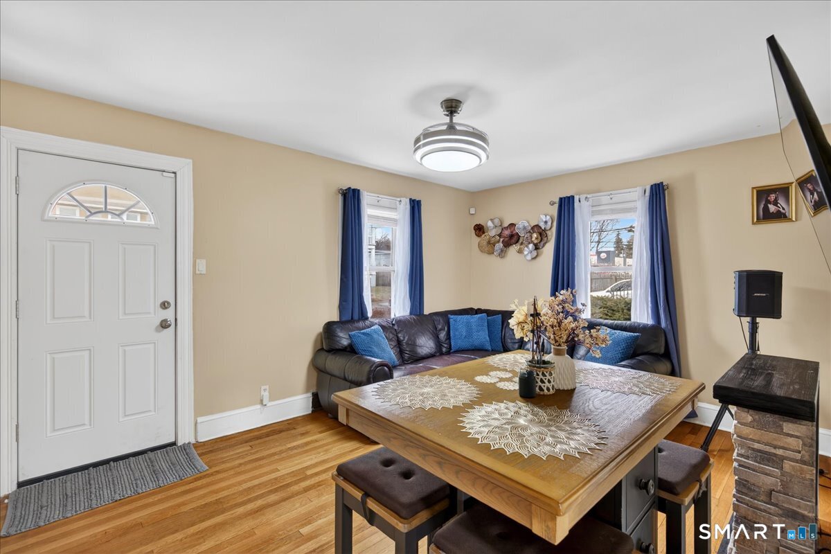 35 Marcel Street Bridgeport, CT 06606 - Photo 11 of 40 a view of a dining room with furniture and wooden floor