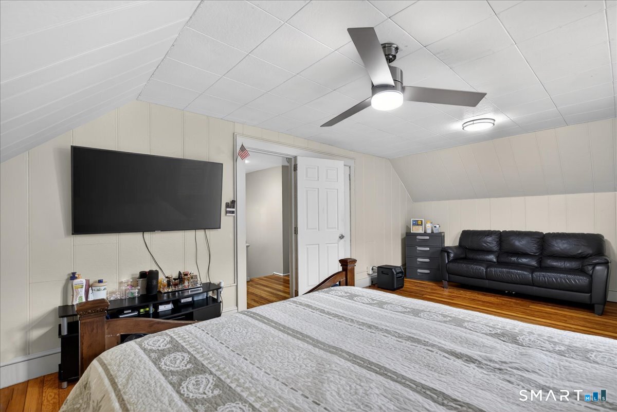 35 Marcel Street Bridgeport, CT 06606 - Photo 14 of 40 a bedroom with a bed and a flat screen tv